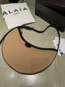 alaia-hat-straw-black-trim-looks-like